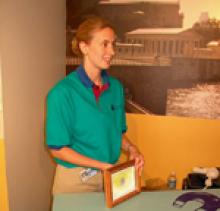 Karianne Smith demonstrates Mystery Mix at the Franklin Institute in Philadelphia , PA Person standing holding a paper