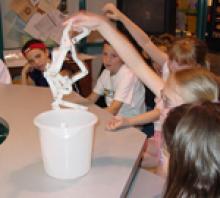 Students with six pack rings and bucket