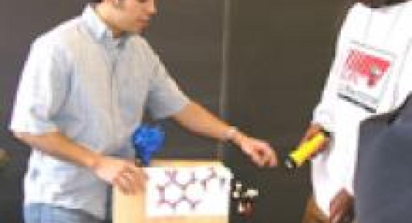 Person standing near a table